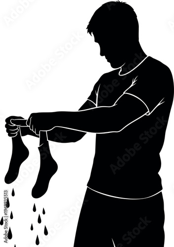Silhouette of a man washing and rinsing socks