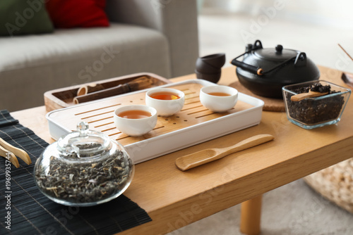 Asian tea set on table in l...
