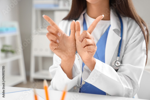 Female doctor using sign la...