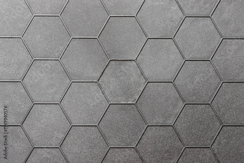 Monochrome gray background with a honeycomb pattern