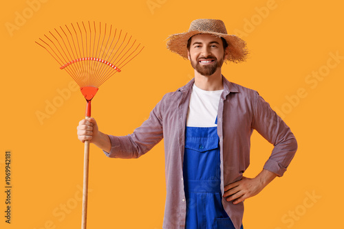 Young happy male farmer wit...