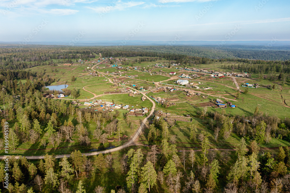 Obraz premium Southern Urals in spring: mountainous Bashkir village of Kyzlar-Birgan. Aerial view.