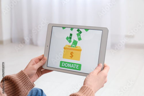 Woman holding tablet with o...