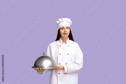 Female chef with silver tra...