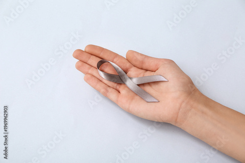 Woman holding awareness rib...