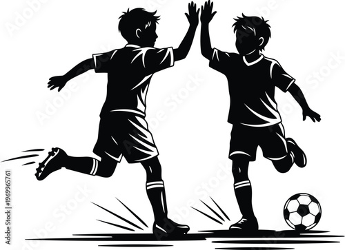 Two energetic young boys celebrating a soccer goal giving each other a high five