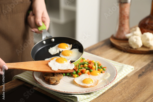 Woman preparing tasty dinne...