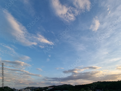 cloud and vanilla sky background with dark mountain silhouette