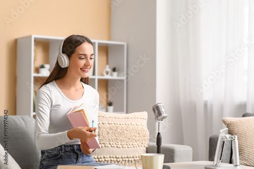 Young woman in headphones w...
