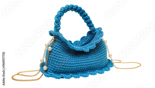 Obraz na plátne Bright blue crocheted hobo bag, adorned with lustrous pearl accents and a gold c