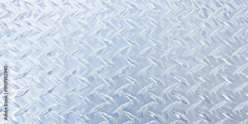 An industrial seamless diamond plate metal texture features a gray steel pattern on a silver aluminum surface for construction material design