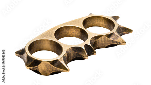 Foto Antique brass knuckles featuring three finger holes jagged edges, and a weathere