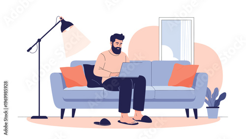Man sitting on a comfortable blue sofa and working on his laptop in a cozy living room setting with a stylish floor lamp.