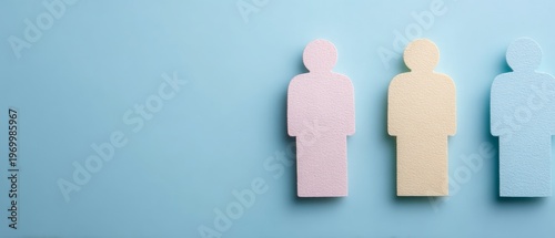 Three Textured Humanoid Figures in Pastel Colors on a Light Blue Background Representing Diversity