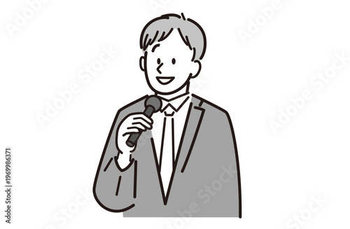 マイクを持っているスーツを着た笑顔の男性