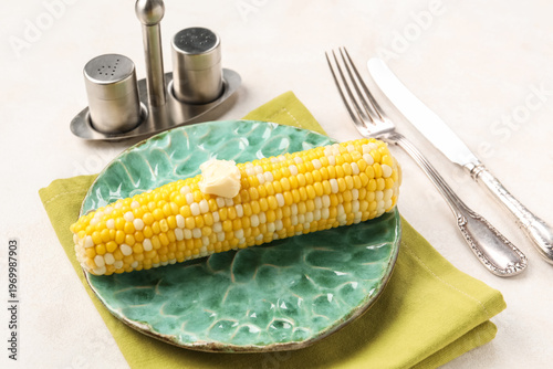 Plate of boiled corn cob wi...