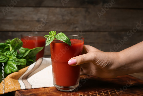 Woman holding tasty tomato ...
