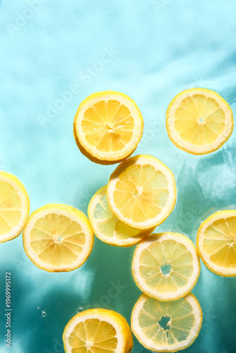 Slices of fresh lemon in wa...