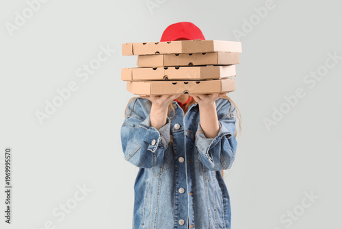 Female courier holding many...