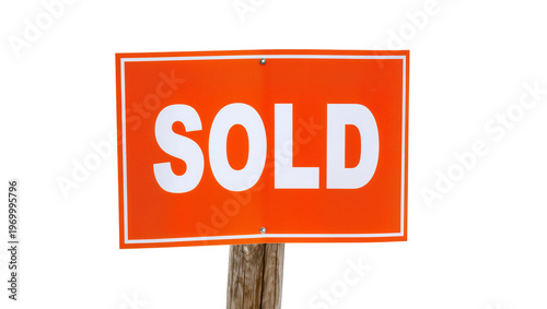 Bright orange rectangular SOLD sign, affixed to weathered wooden stake