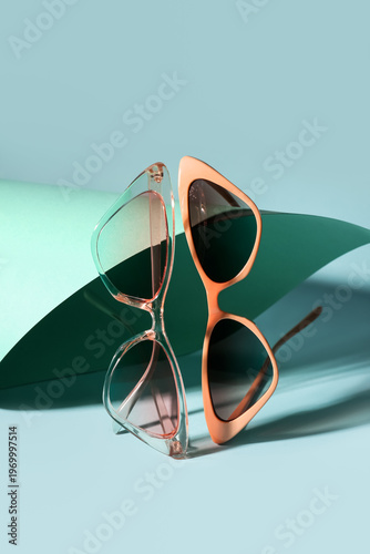 Stylish sunglasses on color...