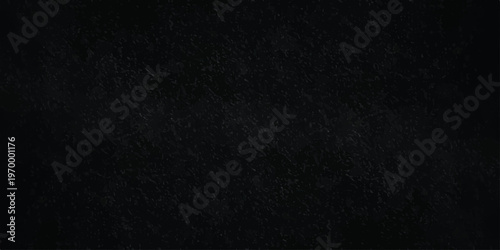 black textured stone background with subtle grain, elegant dark slate or charcoal concrete surface for backdrop