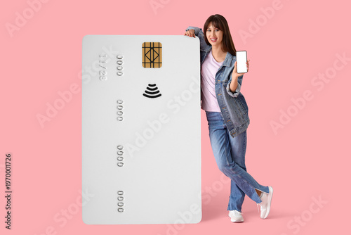Young happy woman with mobi...