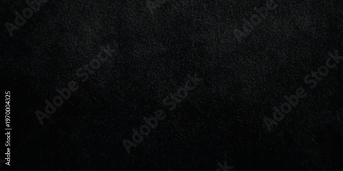 black textured stone background with subtle grain, elegant dark slate or charcoal concrete surface for backdrop