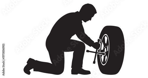 Mechanic Silhouette using a steel lug wrench to tighten the nuts on a car wheel in this detailed black and white vector graphic illustration depicting automotive maintenance.
