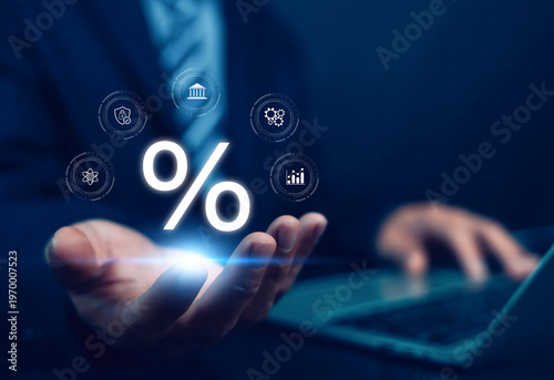 Foto Business finance concept with glowing percentage symbol above businessman hand using laptop, representing interest rate, investment, banking, financial growth, digital economy