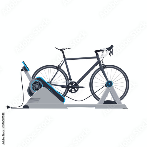 Dark gray bicycle mounted on a grey stationary bike trainer with a blue accent
