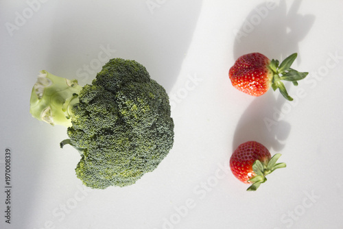 fresh strawberry and Broccoli isolated white background