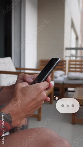 Typing on smartphone with animated chat bubbles overlay. Online messaging concept, close-up hands using mobile phone, social media communication. Vertical video with copy space 9:16.