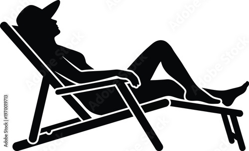 Silhouette of a relaxed person reclining on a beach chair
