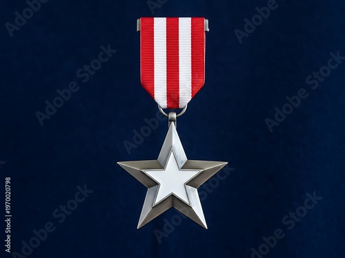 Silver star medal with red and white striped ribbon on dark blue background