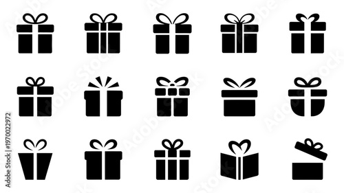 A diverse array of solid black gift boxes with assorted ribbon styles and an open box.