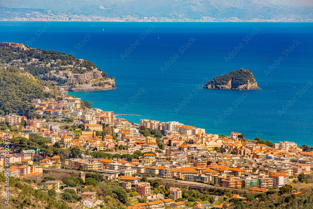 Naklejka premium Aerial panoramic view of the coast of Spotorno, Bergeggi Island, Torre del Mare, Liguria, province of Savona, Italy. Riviera dei Fiori. Western Riviera. Ligurian Sea