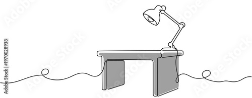 Desk with lamp resting on surface in minimal white studio