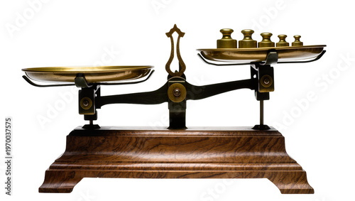 Foto Antique brass balance scale, displaying various gold weights on one tray