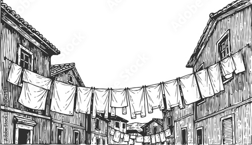 Old village street with wooden houses and clothes hanging on lines drying outdoors