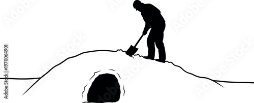 Silhouette of a person building a snow shelter