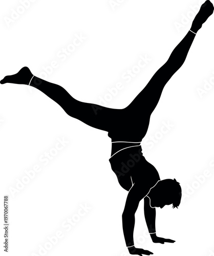 Silhouette of a woman doing a handstand with one leg raised