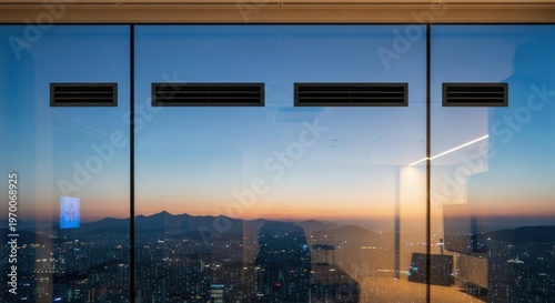 Urban cityscape view from a high-rise window during twilight.