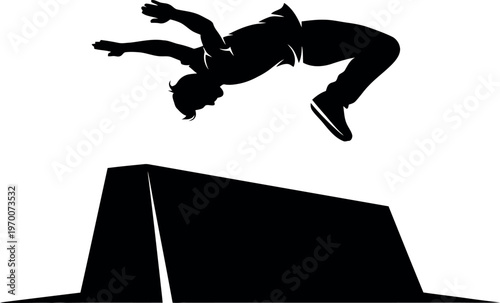 Silhouette of a skateboarder performing a trick over a ramp silhouette