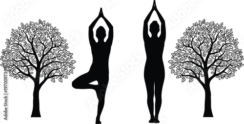 Black silhouette of a young woman practicing yoga tree pose and mountain pose standing between two leafy green trees for wellness and meditation.