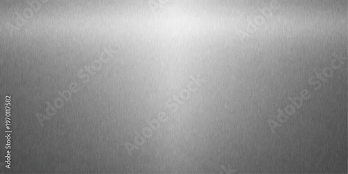 A shiny silver brushed metal texture background features a grey stainless steel plate surface with a metallic aluminum pattern and light reflections on a textured material backdrop
