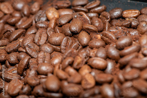 Roasted coffee beans macro background with shallow depth of field