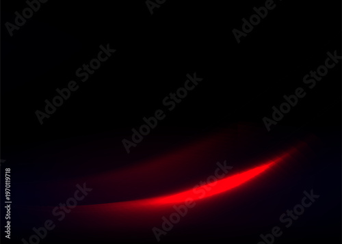 Abstract glowing red light streak on dark background