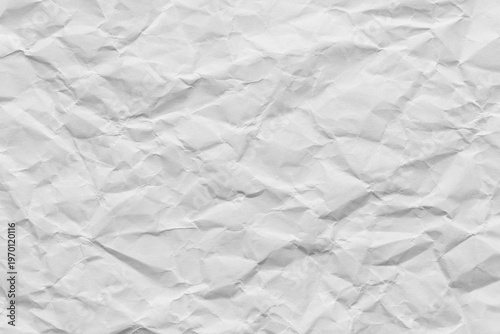 Foto Crumpled white paper texture background, Top view of wrinkled paper sheet,macro,Close-up of a white crumpled paper texture background