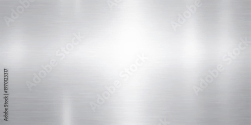 A polished silver brushed metal texture background with a shiny stainless steel surface and light grey metallic reflections on an aluminum plate backdrop pattern